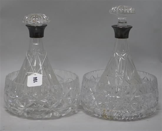 A pair of silver-mounted cut glass ships decanters and two cut glass fruit bowls